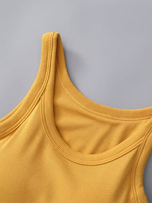 Ribbed knit mustard yellow tank top with built-in bra and scoop neckline.