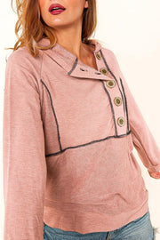 Dusty pink knit hoodie with contrast stitching and button front detail.
