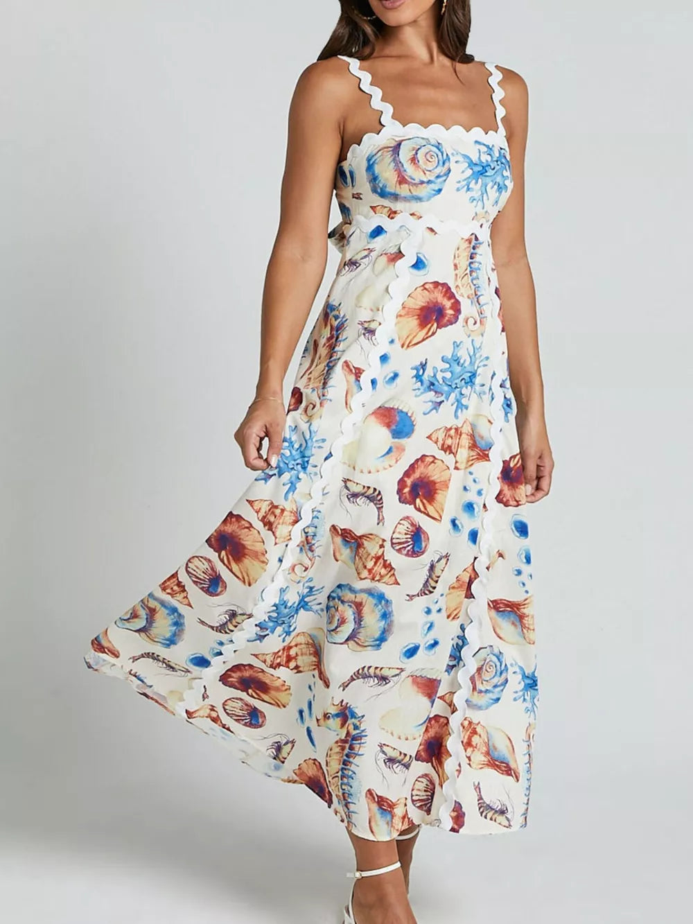 Seashell print midi dress with scalloped neckline and hem.