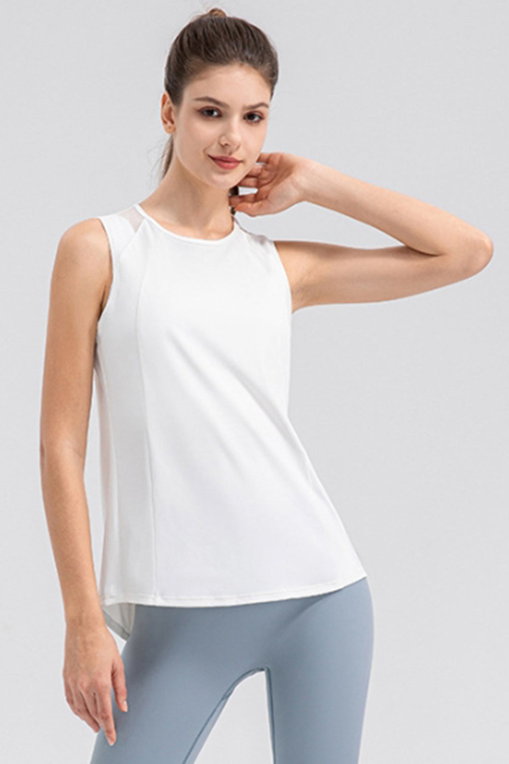 White mesh panel performance tank top with round neckline and sleeveless design