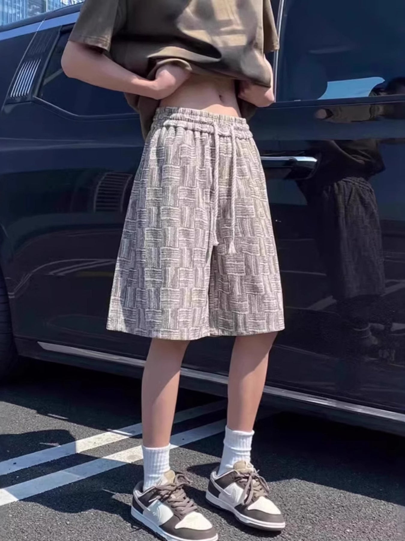 Textured drawstring shorts in apricot white with a basketweave pattern, casual fit.
