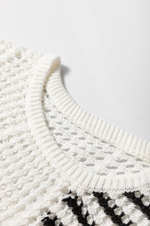White crochet knit pullover sweater with black graphic stripe detail and ribbed neckline.
