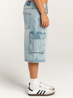 Light blue denim cargo bermuda shorts with buttoned cargo pocket detail.
