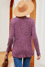 Lilac ribbed knit top with eyelet shoulder detail and long sleeves.