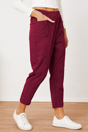 Corduroy barrel-leg utility pants in Scarlet with elastic waist and pockets.