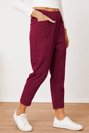 Corduroy barrel-leg utility pants in Scarlet with elastic waist and pockets.