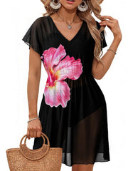 Black mini dress with pink hibiscus print, V-neck, short sleeves, sheer fabric, and a slit.