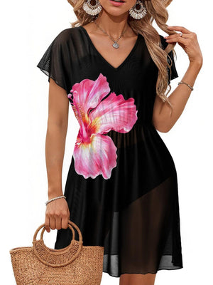 Black mini dress with pink hibiscus print, V-neck, short sleeves, sheer fabric, and a slit.