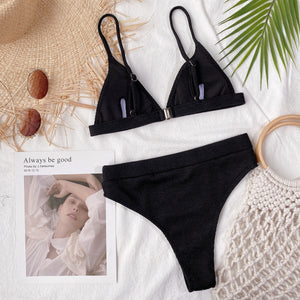 Black ribbed triangle bikini top and high-waist brief with metal clasp detail.