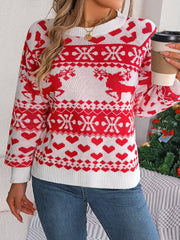 Red and white acrylic jacquard knit sweater with reindeer and heart pattern.