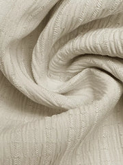 Textured ivory fabric with vertical ribbed pattern, close-up detail