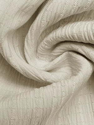 Textured ivory fabric with vertical ribbed pattern, close-up detail