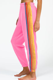 Pink track pants with rainbow stripe detail down the side