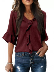 Burgundy maternity shirt with V-neck, cascading ruffles, and 3/4 bell sleeves.