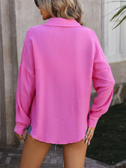 Pink textured cotton overshirt with relaxed silhouette and long sleeves.