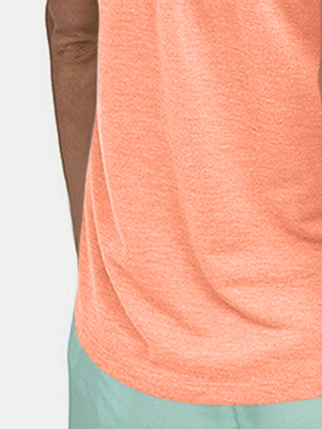 Coral racerback tank top with a heathered texture and a relaxed fit.