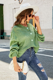Green acrylic cropped cardigan with bubble sleeves and textured pattern
