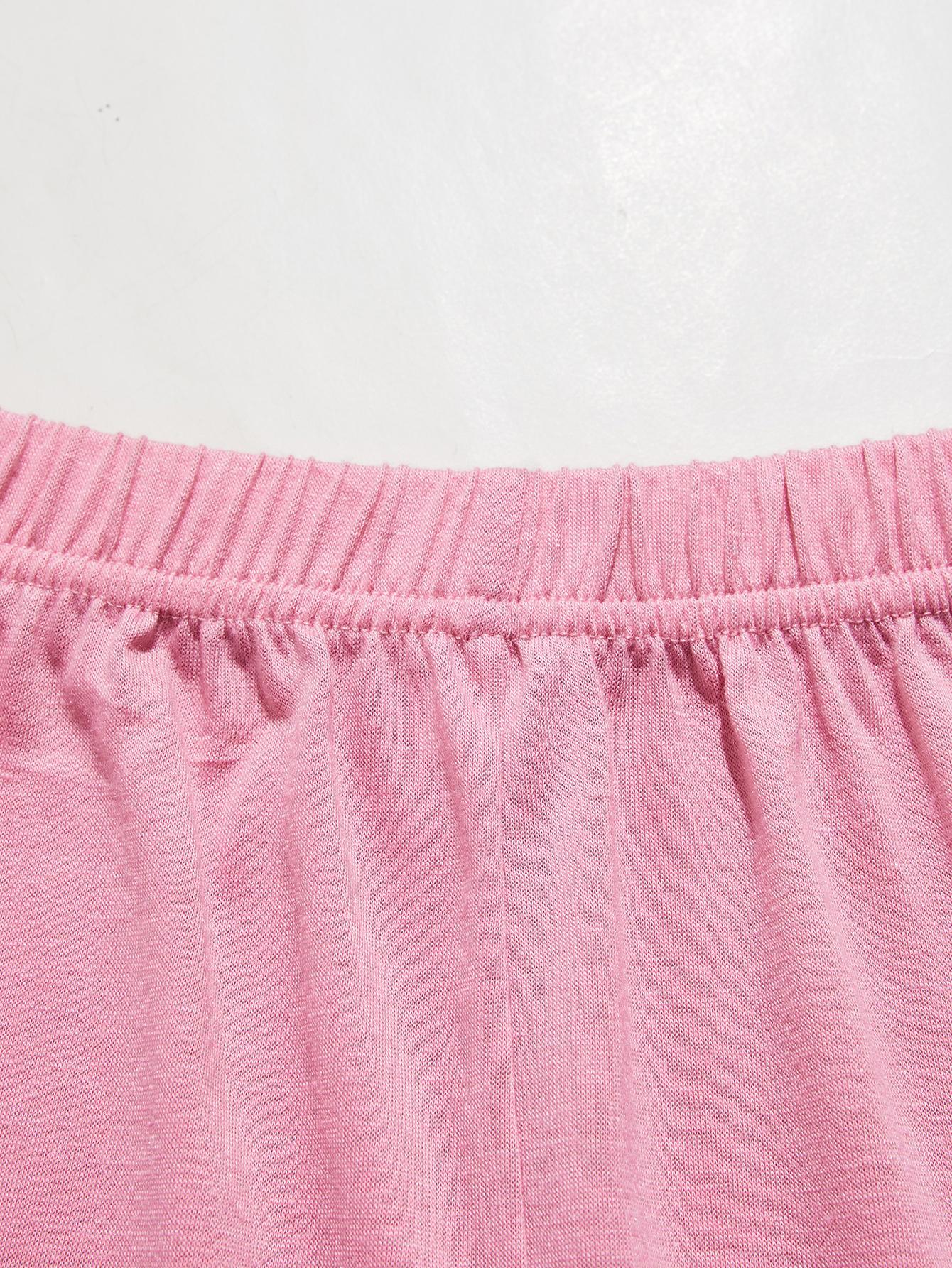 Pink lounge set shorts with elastic waistband and lace trim detail.