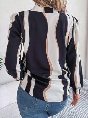 Wavy stripe collared blouse in black with white and tan wavy stripes, long sleeves, and a relaxed fit.