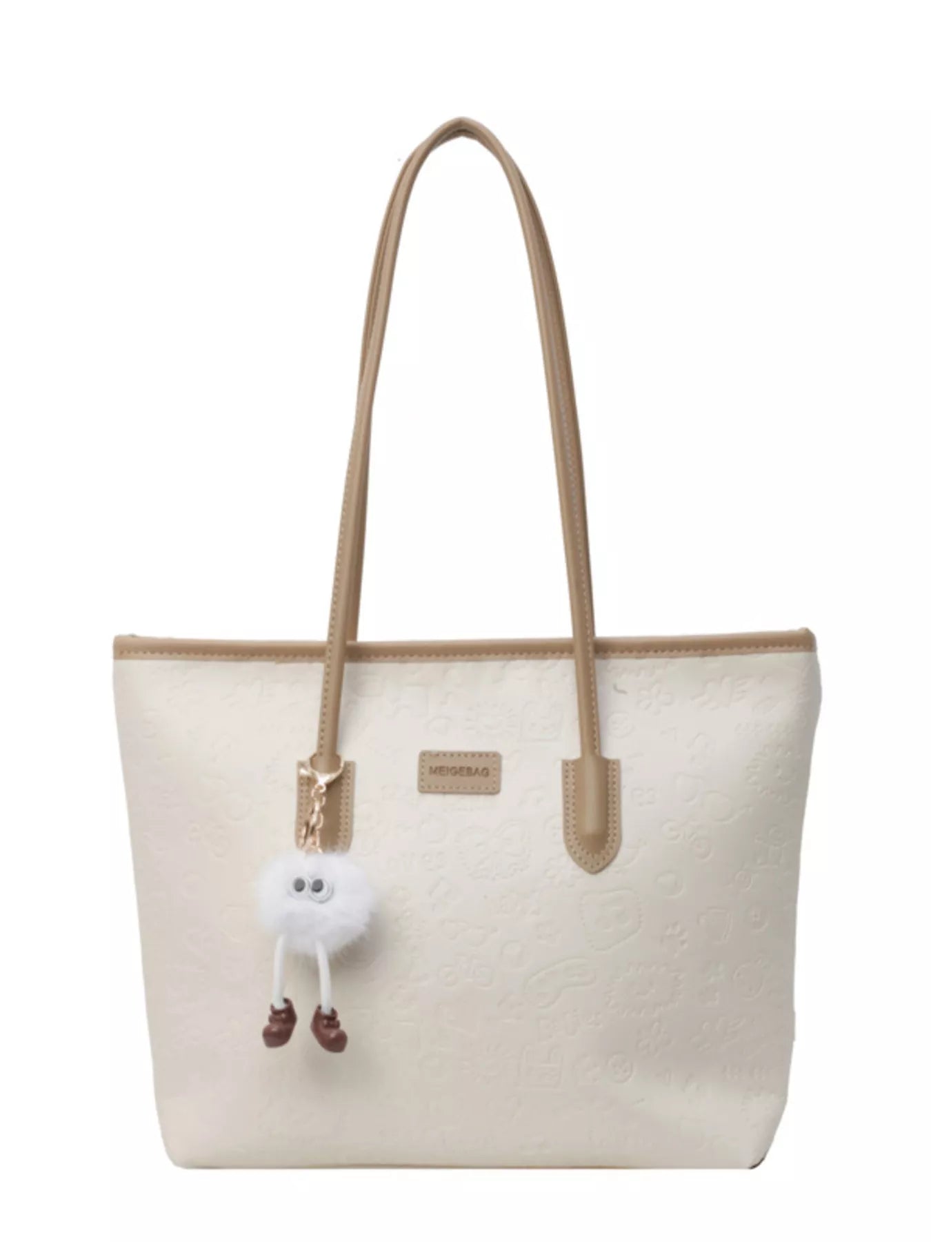 Embossed PU leather tote bag in cream with tan trim and a fluffy charm.