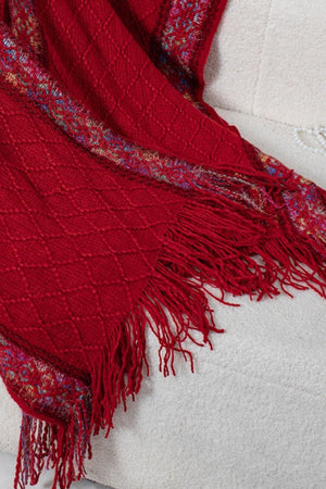 Burgundy knit hooded wrap with diamond pattern and colorful embroidered trim.