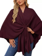 Burgundy tie-front knit cape top with draped elegance and V-neck.