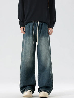 Oversized drawstring washed denim jeans in Vintage Blue with a relaxed fit.