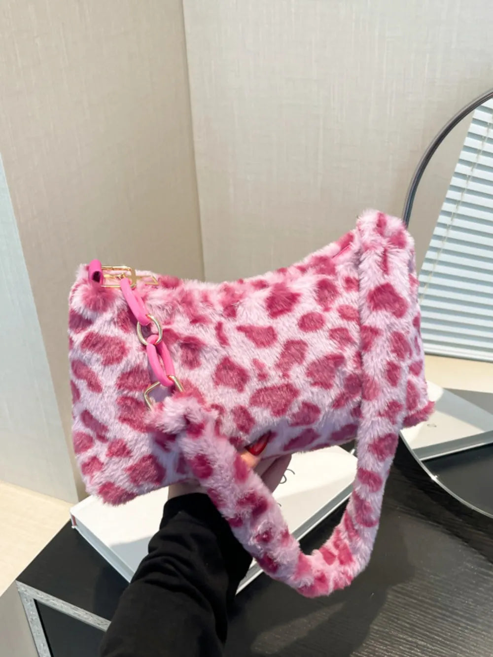 Fuchsia pink leopard print faux fur shoulder bag with chain detail
