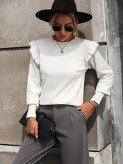 White crew neck sweater with contrast trim ruffle shoulders and ribbed cuffs.