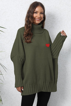 Army green knit turtleneck sweater with batwing sleeves and red heart embroidery.