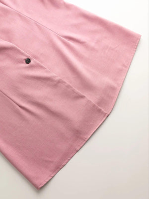 Pink blazer shorts set detail with button and notched lapel.