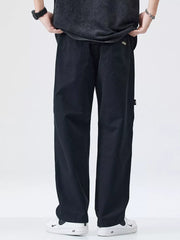 Black loose-fit cargo pants with back pockets and utility details.