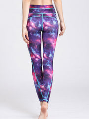 Cosmic print contour leggings in purple with turquoise piping and a high waist.