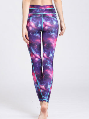 Cosmic print contour leggings in purple with turquoise piping and a high waist.