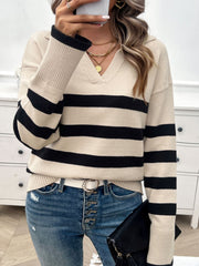 Tan and black striped knit sweater with a collar and v-neckline.