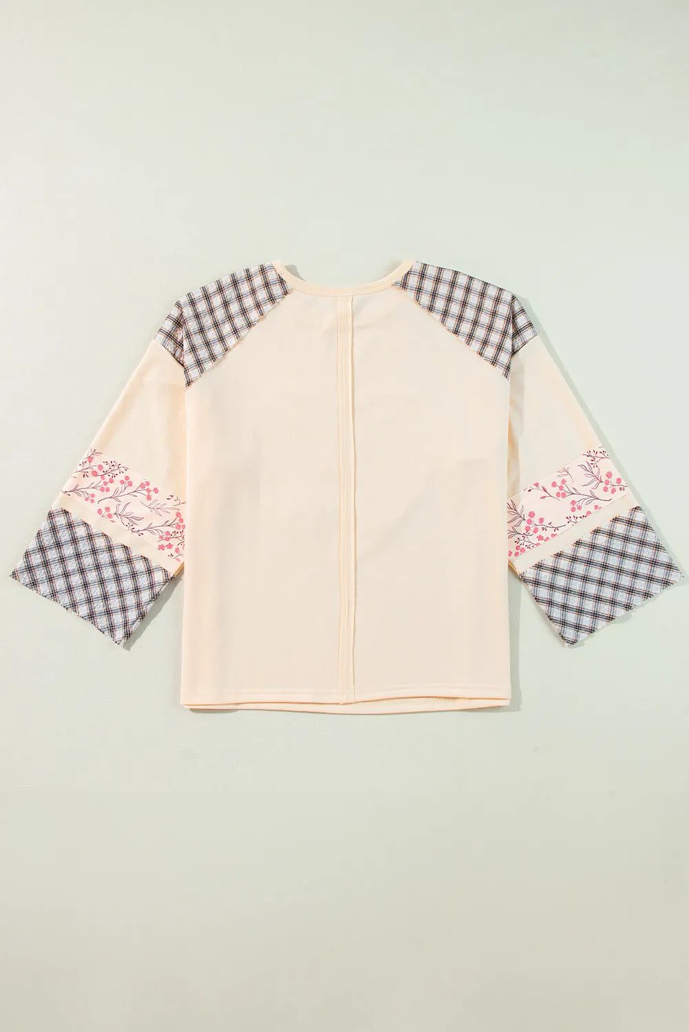 Patchwork heart raglan top in tan with plaid and floral print sleeves.