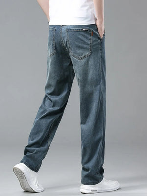 Men's relaxed fit denim sweatpants in light blue, with a comfortable casual style.