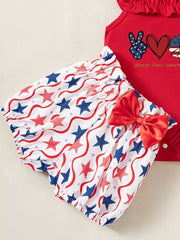 Red baby bodysuit with patriotic graphic and star print bloomer shorts with bow.