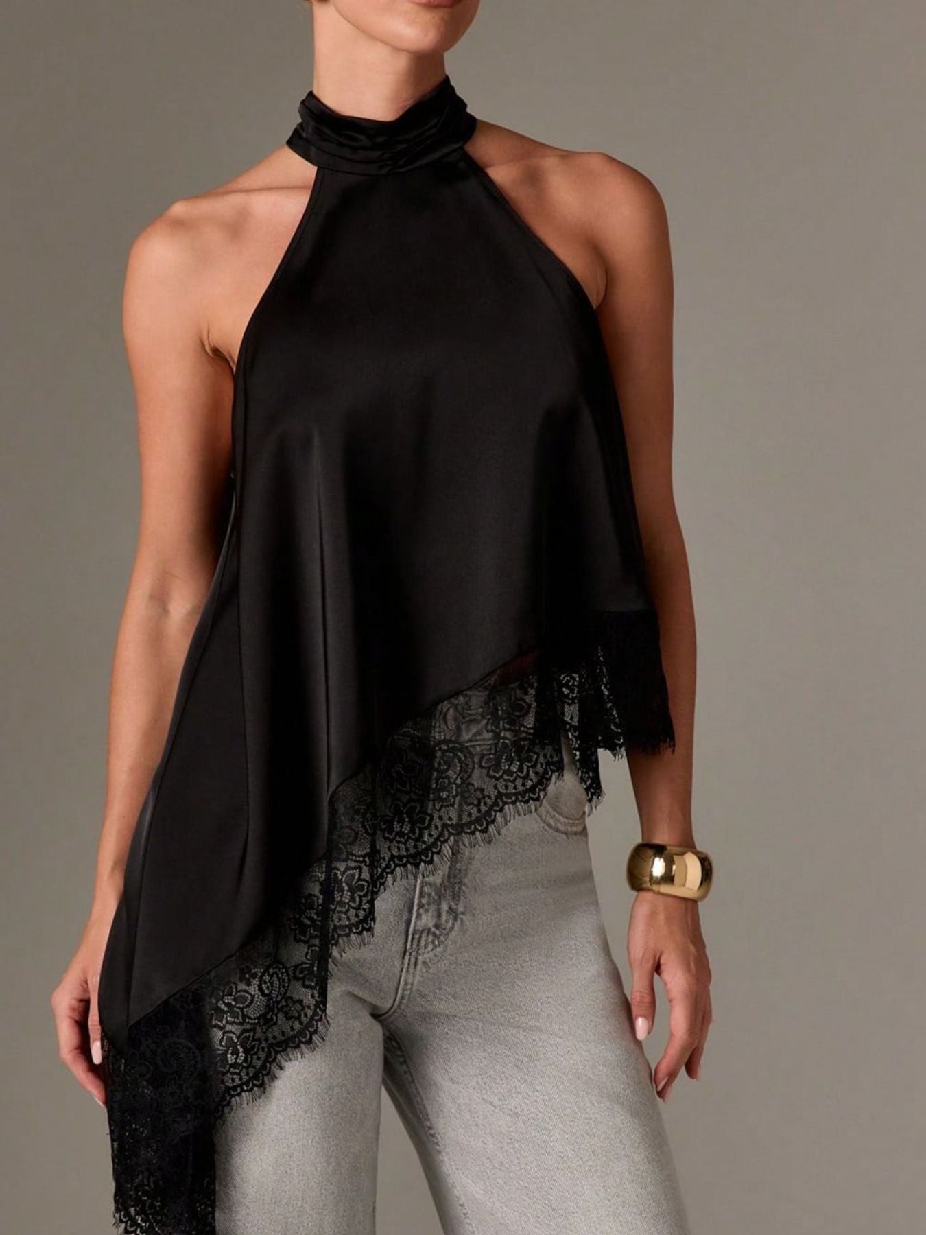 Black halter camisole with lace trim and asymmetrical hem