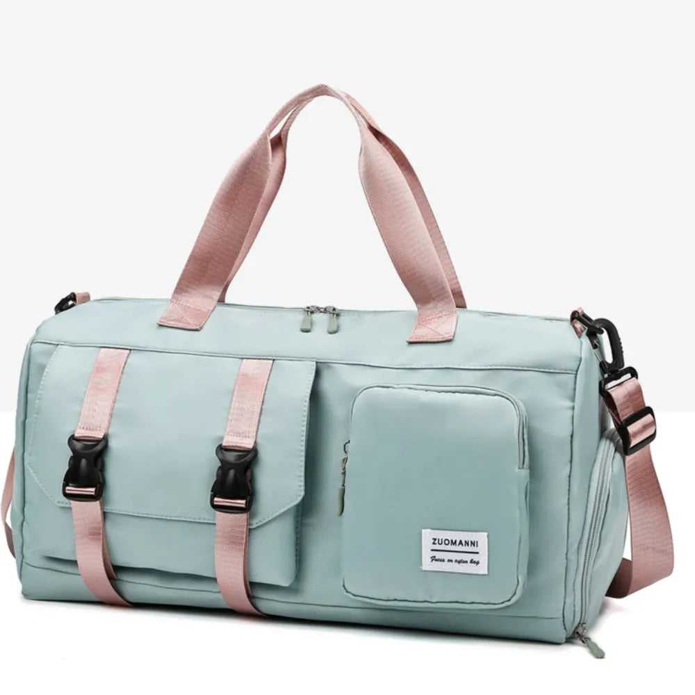 Light Indigo duffel bag with pink straps and buckle details, perfect for travel or gym.