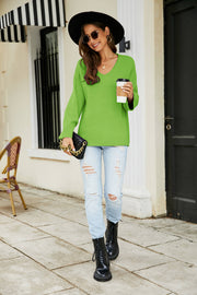 Relaxed fit V-neck knit pullover in yellow-green with long sleeves.