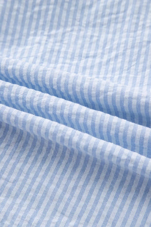 Blue and white striped cotton shirt fabric detail