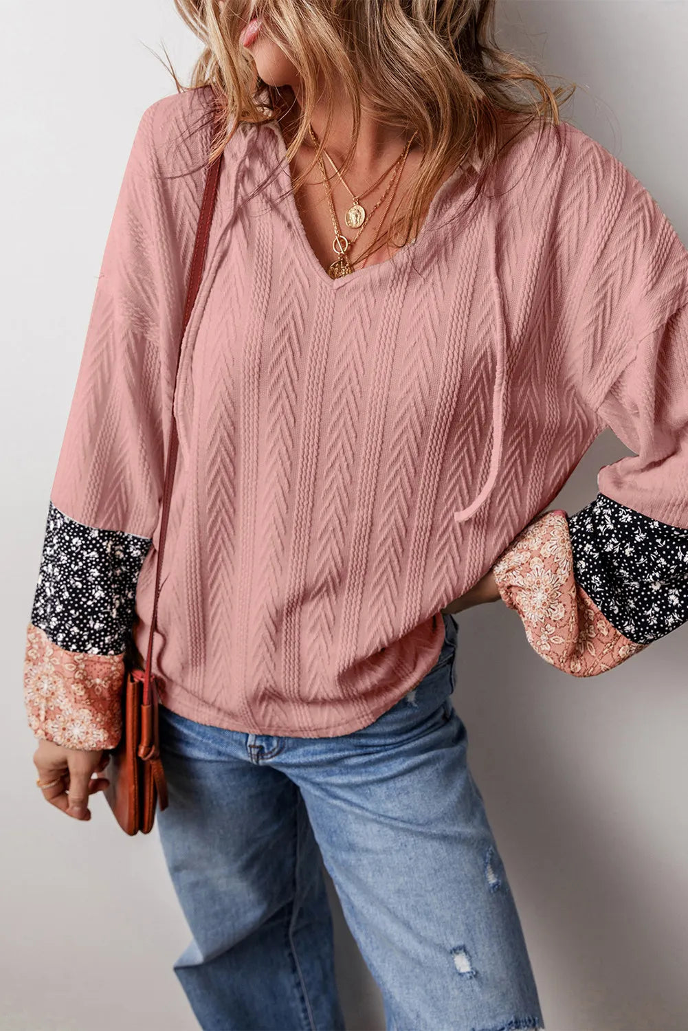 Dusty Pink textured sleeve henley blouse with mixed floral print cuffs and drawstring neckline.