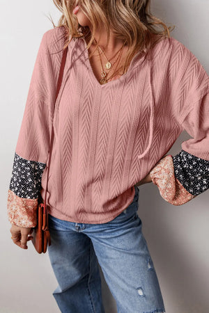 Dusty Pink textured sleeve henley blouse with mixed floral print cuffs and drawstring neckline.