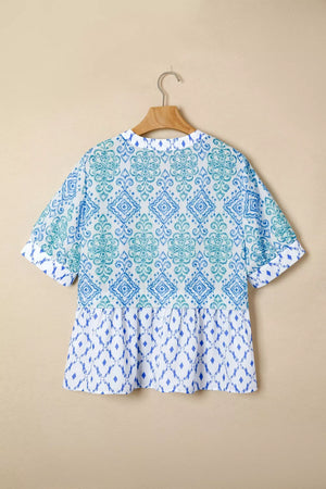 Patchwork babydoll maternity overshirt with puff sleeves in blue and green ikat print.