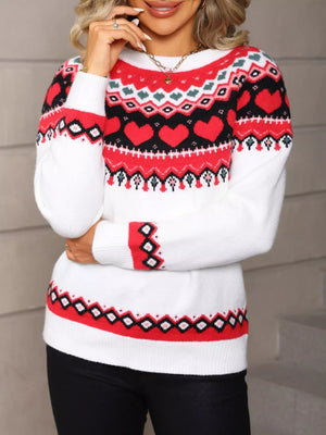 White crew neck sweater with red heart motif pattern and festive trim.