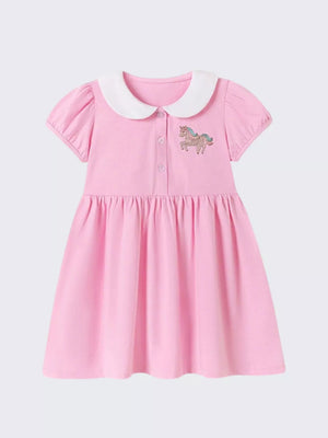 Pink cotton toddler dress with white collar, puff sleeves, and unicorn embroidery.