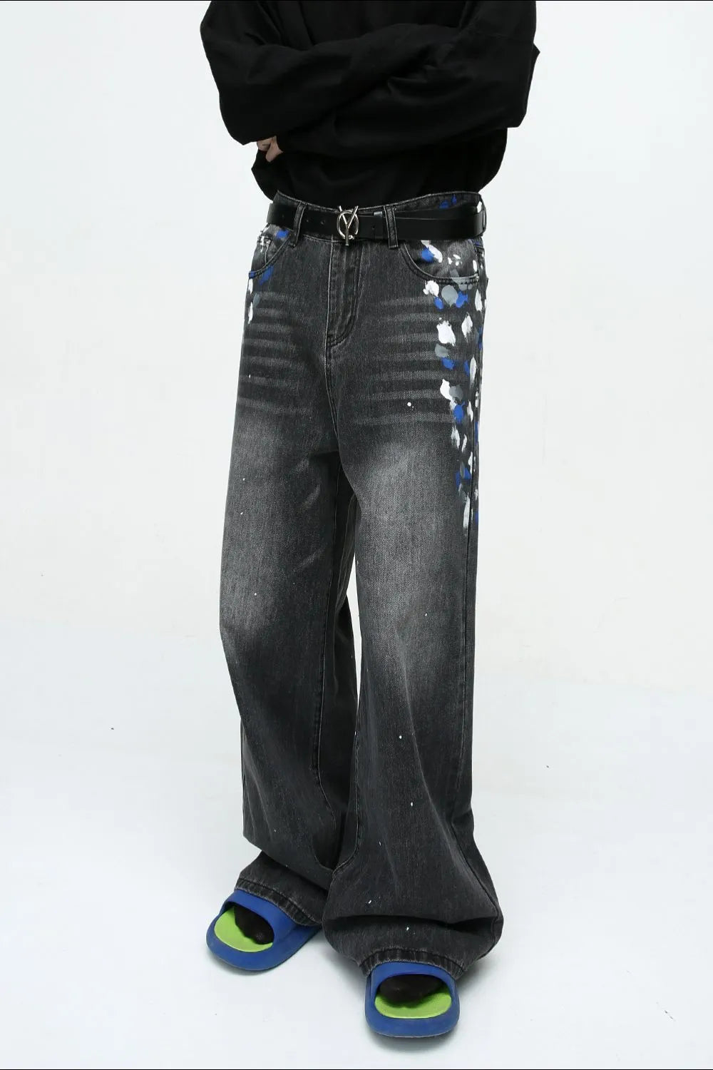 Dark wash wide leg jeans with artistic brushstroke details and paint splatters.
