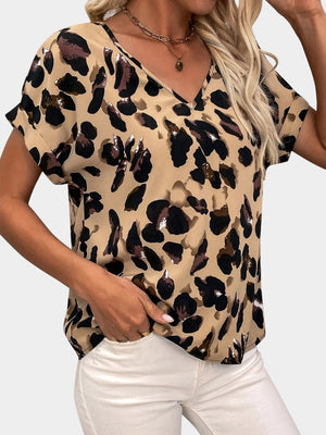 V-neck blouse with short sleeves and a bold leopard print in khaki and brown.