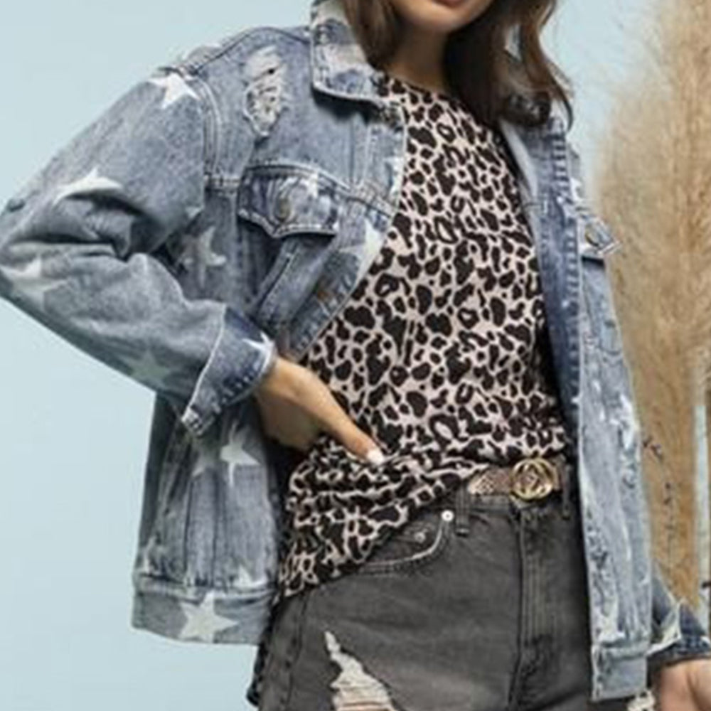 Light wash denim trucker jacket with white stars and distressed details.